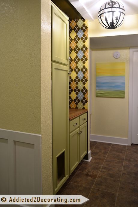 tiny condo laundry room disguised as a hallway, foyer, laundry rooms, Cabinets for added storage and a small countertop perfect for folding laundry right out of the dryer