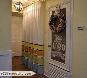 tiny condo laundry room disguised as a hallway, foyer, laundry rooms, Washer dryer closet with inexpensive curtains painted with latex paint and the HVAC door dressed up with trim and chalkboard paint