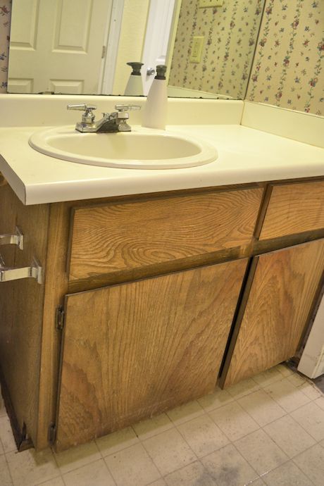 bathroom vanity makeover, bathroom ideas, countertops, woodworking projects, The bathroom vanity before with very old and disgusting apartment grade cabinet and laminate countertop