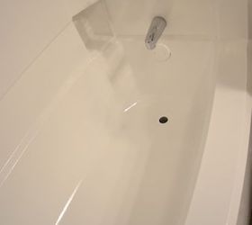 diy painted bathtub, bathroom ideas, painting, The bathtub with it s new shiny bright white paint I couldn t get the two drains off so I just painted right over them