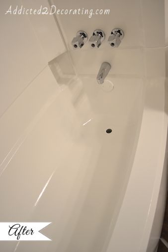 diy painted bathtub, bathroom ideas, painting, The bathtub with it s new shiny bright white paint I couldn t get the two drains off so I just painted right over them