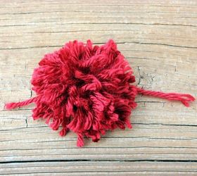 creating heart shaped pom poms, crafts, valentines day ideas, This is what the pom pom will look like right before you trim it into the heart shape