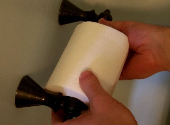 one simple fix that stops loose bathroom towel bars toilet paper holders and more, home maintenance repairs, Does your toilet paper holder jiggle Add 1 2 drops of 242 to the set screws