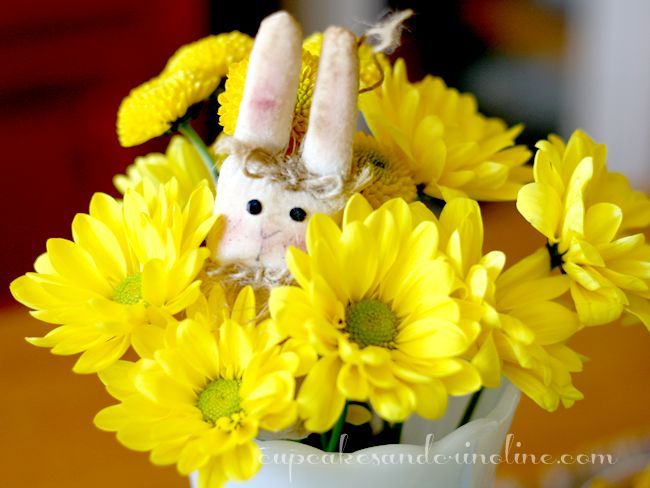 springtablescape for a kid friendly table, easter decorations, seasonal holiday d cor, I placed some fresh yellow flowers in a Thrift Store milk glass vase and tucked in a cloth bunny