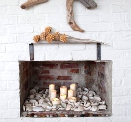 30 ways to display a seashell collection, home decor, Non functional fireplace is filled with seashells