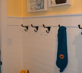 laundry mud room revamp on a budget, chalk paint, cleaning tips, laundry rooms, painting, white horizontal paneling two rows of hooks and custom shadow box art with baby clothes at thehappyhousie