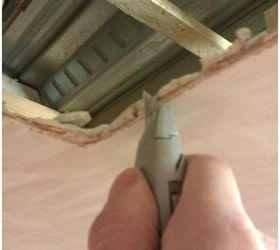 how to repair a small hole in your ceiling, Using a trimming knife cut the ceiling back and make a square area to be replaced