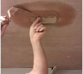 how to repair a small hole in your ceiling, Continuing to hold onto the nail and using a Thistle Bonding plaster the patch is continued to be built out level with the existing surface