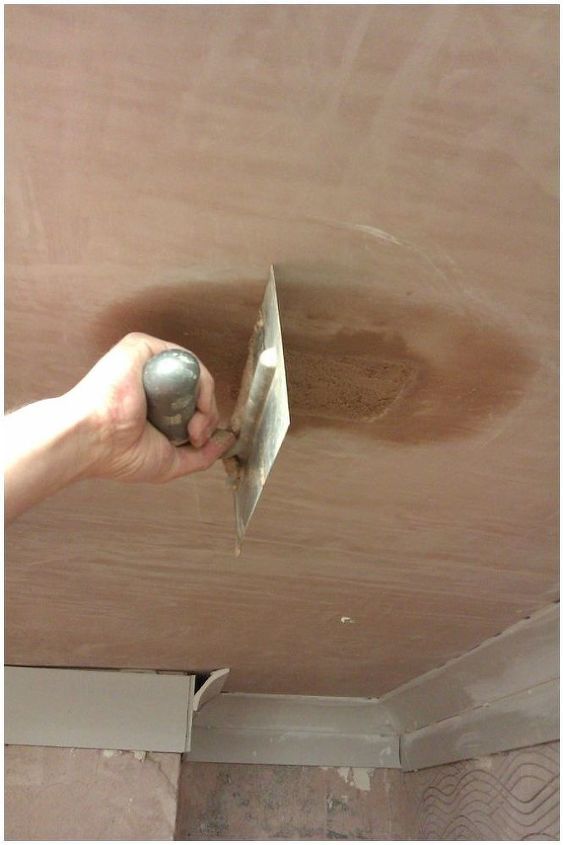 how to repair a small hole in your ceiling, Once filled level the patch is ruled level using either the plastering trowel or a short piece of timber