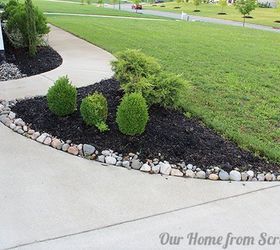 protecting mulch beds with a stone perimeter, concrete masonry, diy, flowers, gardening, We previously added some river rocks along the edge of our upper flower beds to address the exact same issue After almost two years of a stone border the mulch rarely gets washed out and the rocks look great