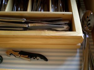 thrifty and pretty drawliner using prepasted wallpaper, crafts, home decor, kitchen cabinets, Look how easy that was then get out that corkscrew and put it to good use so you can celebrate your pretty and clean new drawers