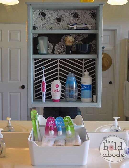 create some additional and unusual storage space in your bathroom, bathroom ideas, cleaning tips, shelving ideas, storage ideas, Attach directly over a large mirror to create more storage space Click over to the post to see how I managed to hang this shelf