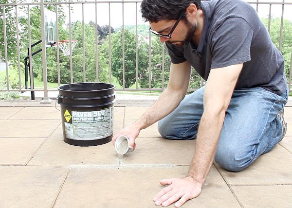 stone patio care 3 tips to keep your outdoor oasis clean all summer, home maintenance repairs, how to, patio, Spread polymeric sand onto your patio stones and brush it between them with a broom