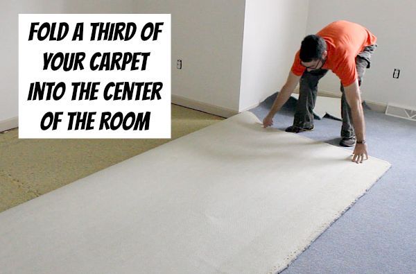 how to remove old stinky carpet a complete step by step guide, diy, flooring, how to, Fold carpet into thirds