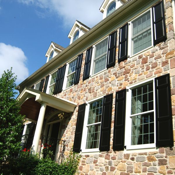 why panel shutters, curb appeal, Black Panels on a Stone House