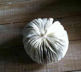 diy paper book pumpkins, crafts, repurposing upcycling, seasonal holiday decor, I went through each page and crinkled it just a tad to help keep it separated from the other pages Here is my pumpkin all fluffed and crinkled