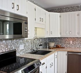 the big reveal a kitchen reno for my parents, diy, home decor, how to, kitchen backsplash, kitchen design, repurposing upcycling, We sanded and painted the existing cabinets I love how fresh and bright they are now The light reflecting backsplash tile adds sparkle and glam