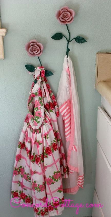 here s our 92 year old kitchen on a budget, home decor, kitchen design, I love vintage aprons and have them hanging in my kitchen nook Great to grab when I m baking