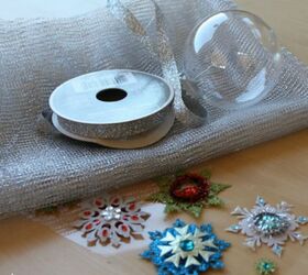 mesh stuffed ornament, christmas decorations, crafts, seasonal holiday decor, Supplies A glass ball ornament Mesh fabric scissors ribbon and a sticker