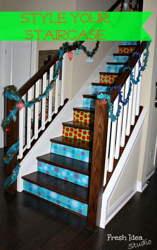 where s your favorite gift wrap hiding this christmas, christmas decorations, crafts, seasonal holiday decor, stairs, Keep your favorite gift wrap in plain sight Style your Staircase with a roll or two of wrapping paper and double sided tape