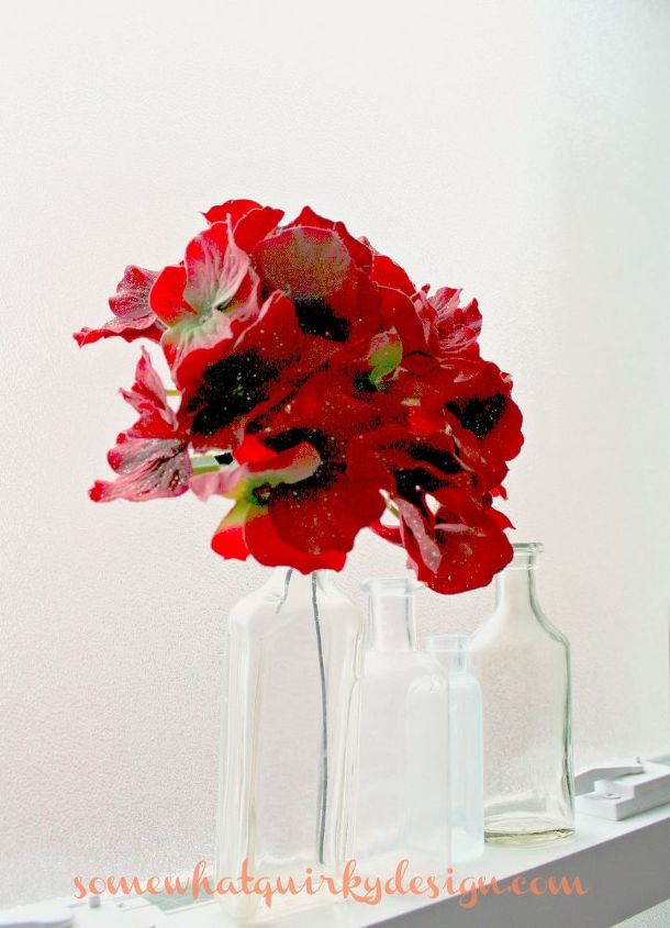 do you decorate your bathroom for christmas, bathroom ideas, christmas decorations, seasonal holiday decor, It s easy Put one fake red hydrangea in your antique medicine bottle
