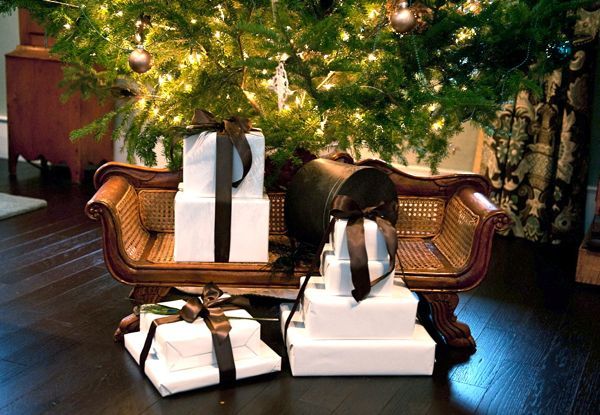 looking for holiday decor inspiration how about peacock feathers, seasonal holiday decor, Wrapped up gifts sitting on my miniature settee under the tree made a pleasing and inviting vignette