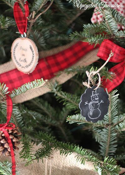 our cabin inspired christmas tree, seasonal holiday d cor, We drew on some chalkboard wooden tags and hung those up with twine They were originally going to be used to display table numbers at our wedding reception