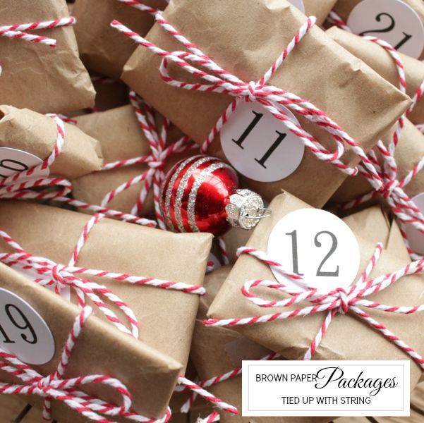 brown paper packages advent, repurposing upcycling, seasonal holiday decor, Small toy stickers and candy wrapped up in simple brown paper and tied with string