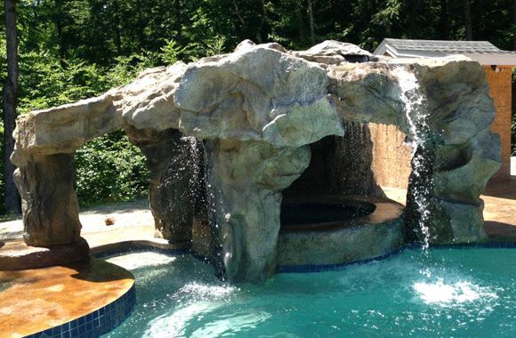 swimming pool waterfalls swimming pool water features swimming pools, outdoor living, ponds water features, pool designs, spas, Swimming Pool Waterfall built with a Grotto and Spa Backyard waterfalls and outdoor jacuzzi compliment this Backyard Swimming Pool Water Feature with lighting design Swimming Pool Waterfall Design Ideas