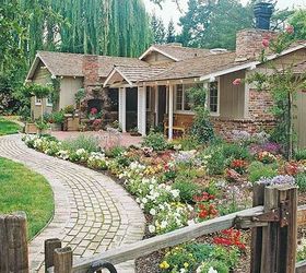 get spring ready add flowers to your front walk, flowers, gardening, landscape, Create more visual impact by using your plantings to accent a gently curving walkway BHG