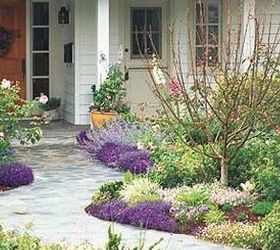 get spring ready add flowers to your front walk, flowers, gardening, landscape, Repetition is a trick used by garden designers to create balance and cohesivess Make your front yard stand out from the crowd by repeating pockets of color to draw your eye down a walkway or along the front of your house BHG
