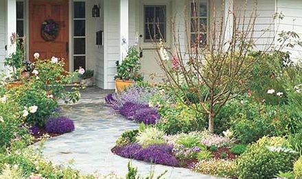 get spring ready add flowers to your front walk, flowers, gardening, landscape, Repetition is a trick used by garden designers to create balance and cohesivess Make your front yard stand out from the crowd by repeating pockets of color to draw your eye down a walkway or along the front of your house BHG