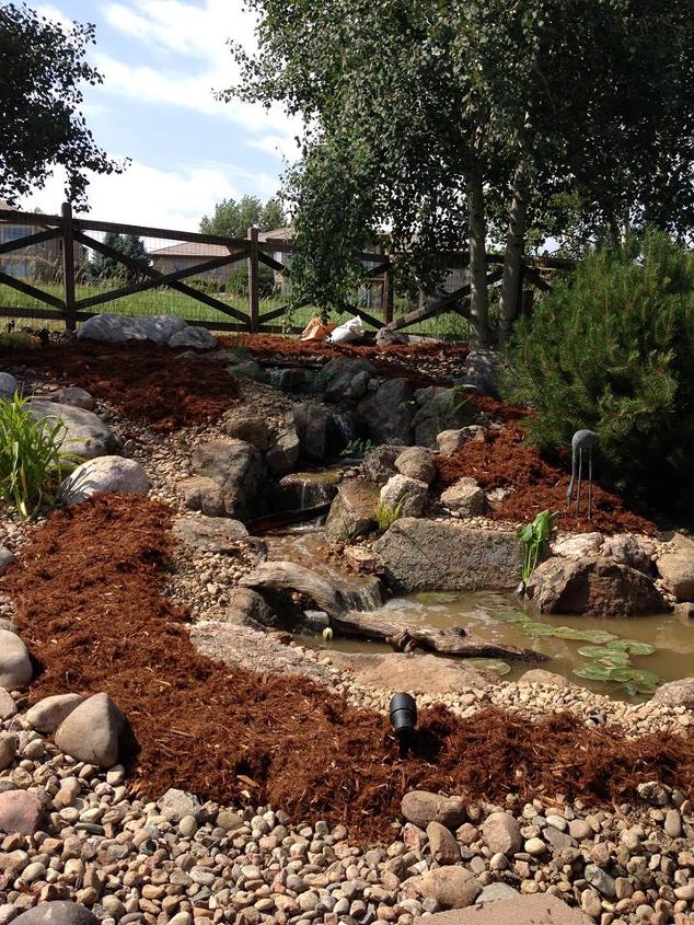 from a pile of cobbles to a beautiful pondless waterfall, landscape, outdoor living, perennial, ponds water features