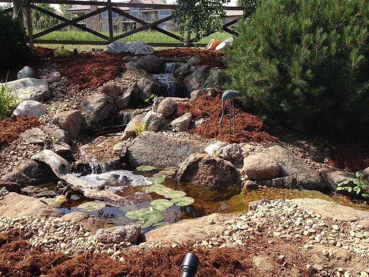 from a pile of cobbles to a beautiful pondless waterfall, landscape, outdoor living, perennial, ponds water features