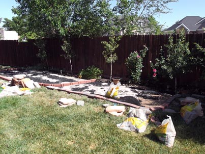 transforming ugly old gravel patio, oh my back