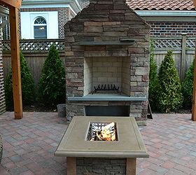a backyard upgrade with a unique vegetable garden fence, Outdoor Fireplace