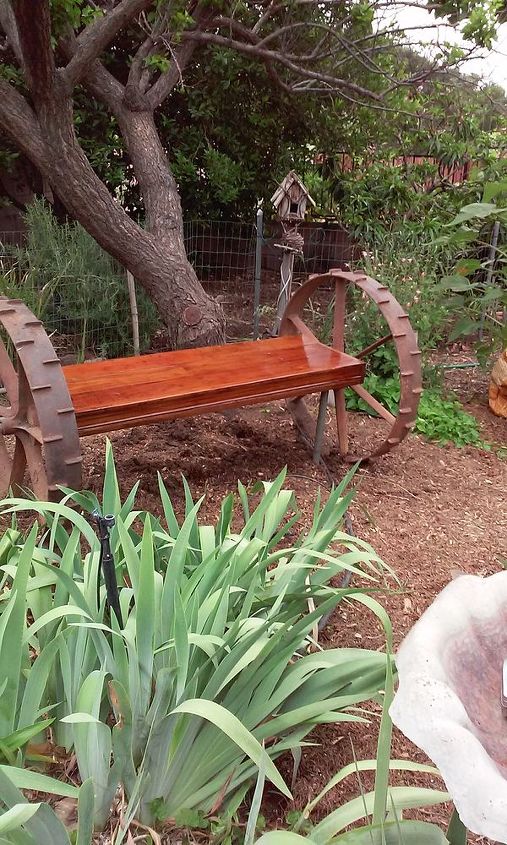 tractor wheel garden bench, outdoor furniture, outdoor living, repurposing upcycling