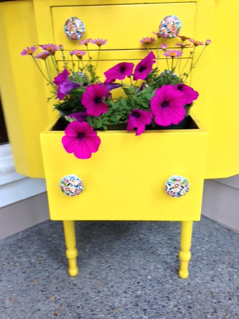 vintage sewing cabinet turned porch planter