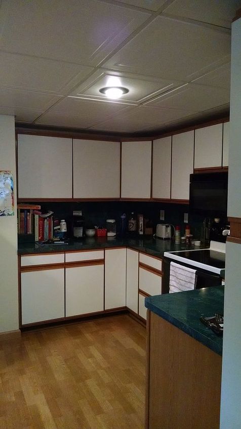 any ideas on how to update these old cabinets, Hate the countertop too but I can wait to replace it