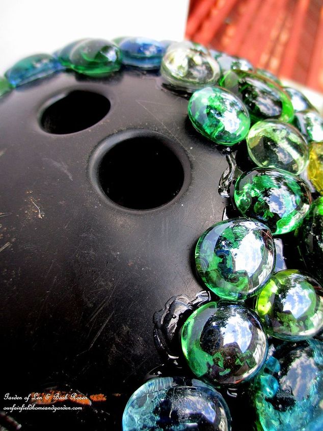 easy diy project bowling ball garden accent, crafts, gardening, repurposing upcycling, Adding glass beads a few rows at a time
