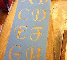 vintage ironing board turned into a welcome sign for the porch
