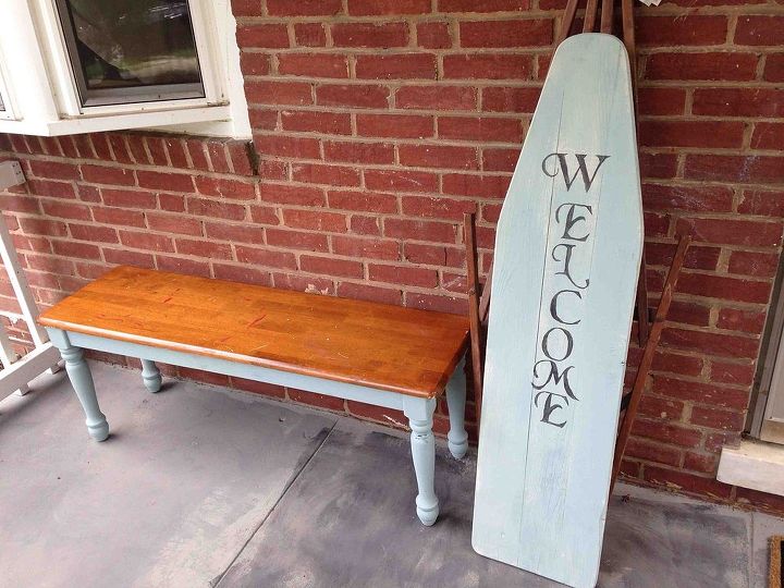 vintage ironing board turned into a welcome sign for the porch