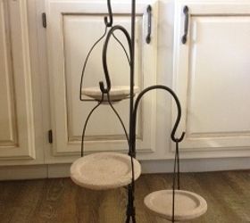 i need some suggestions for this wonder piece, repurposing upcycling, Stands about 3 ft tall made of rod iron the plates are made of stone