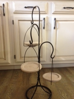 i need some suggestions for this wonder piece, repurposing upcycling, Stands about 3 ft tall made of rod iron the plates are made of stone