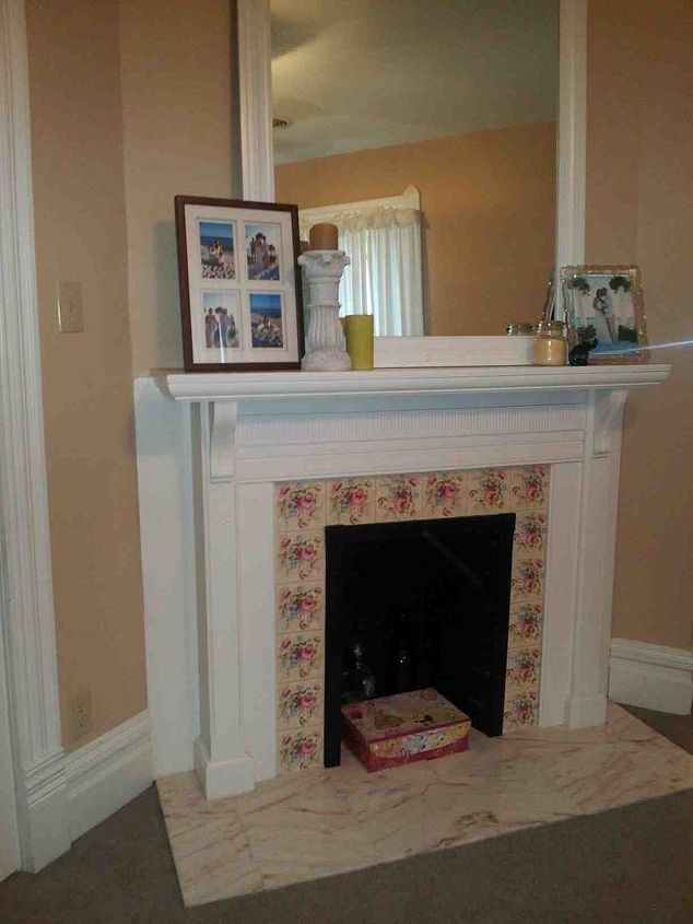 updated my fireplace tile with paint, diy, fireplaces mantels, painting, Before old fashioned roses on the tile