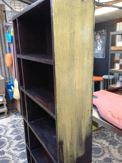 transforming an ordinary wood bookcase with milk paint, decoupage, painted furniture, repurposing upcycling, With a yellow wash over the black