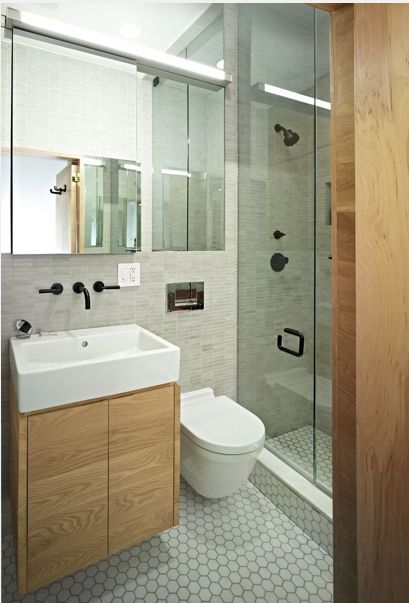 small bathroom solutions, bathroom ideas, small bathroom ideas, Using the same tile across the wall carries the eye across the whole room and makes it feel bigger Along with the use of monochromatic and natural materials this small bathroom does not feel small at all