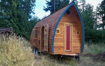 Copper Roofs, Stained Glass, & Dramatic Curves Define These Tiny Homes