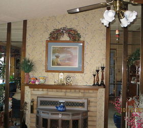 q fireplace mantel update improvement ideas, fireplaces mantels, shows the whole look with mirrors and wood trim Also the colors of the walls are blue with a tan a valance of multi colors that match the old wallpaper