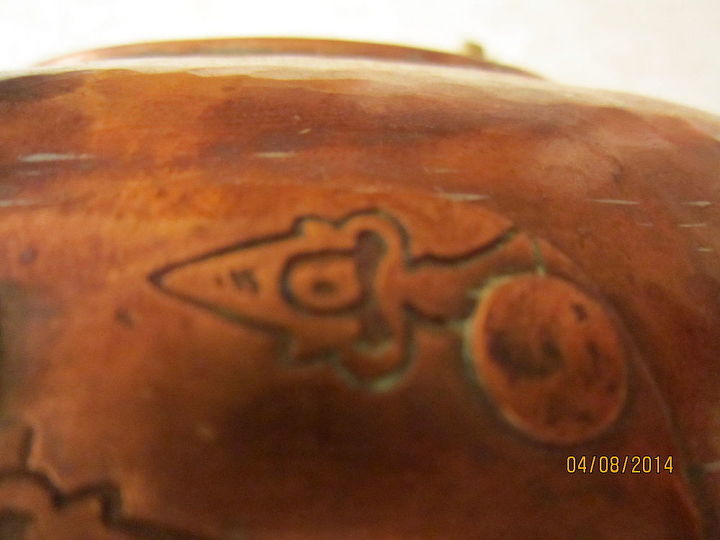 does anyone know what this pot is used for, markings engraved in the copper on the front by locking device